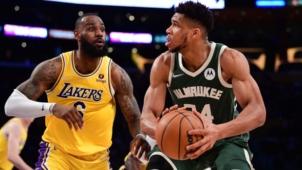 Lebron James guarding Giannis Antetokounmpo.